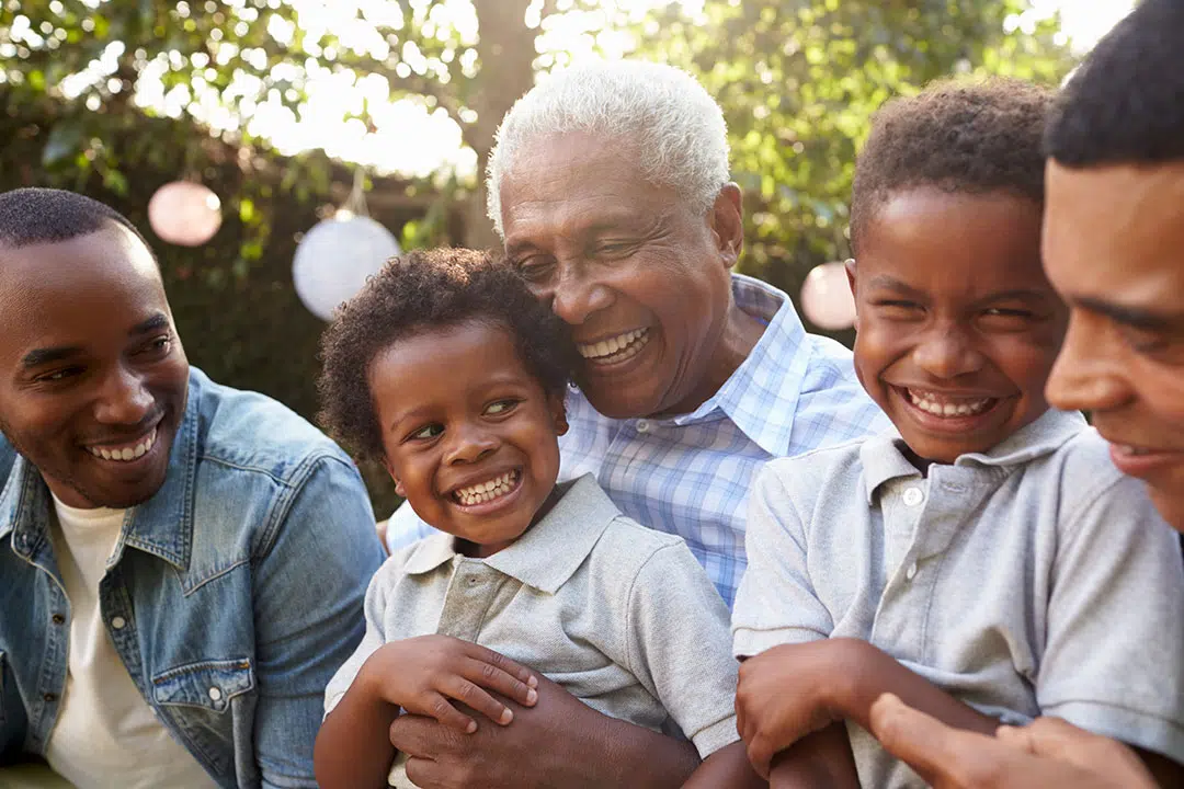 Multigenerational family smiling and laughing