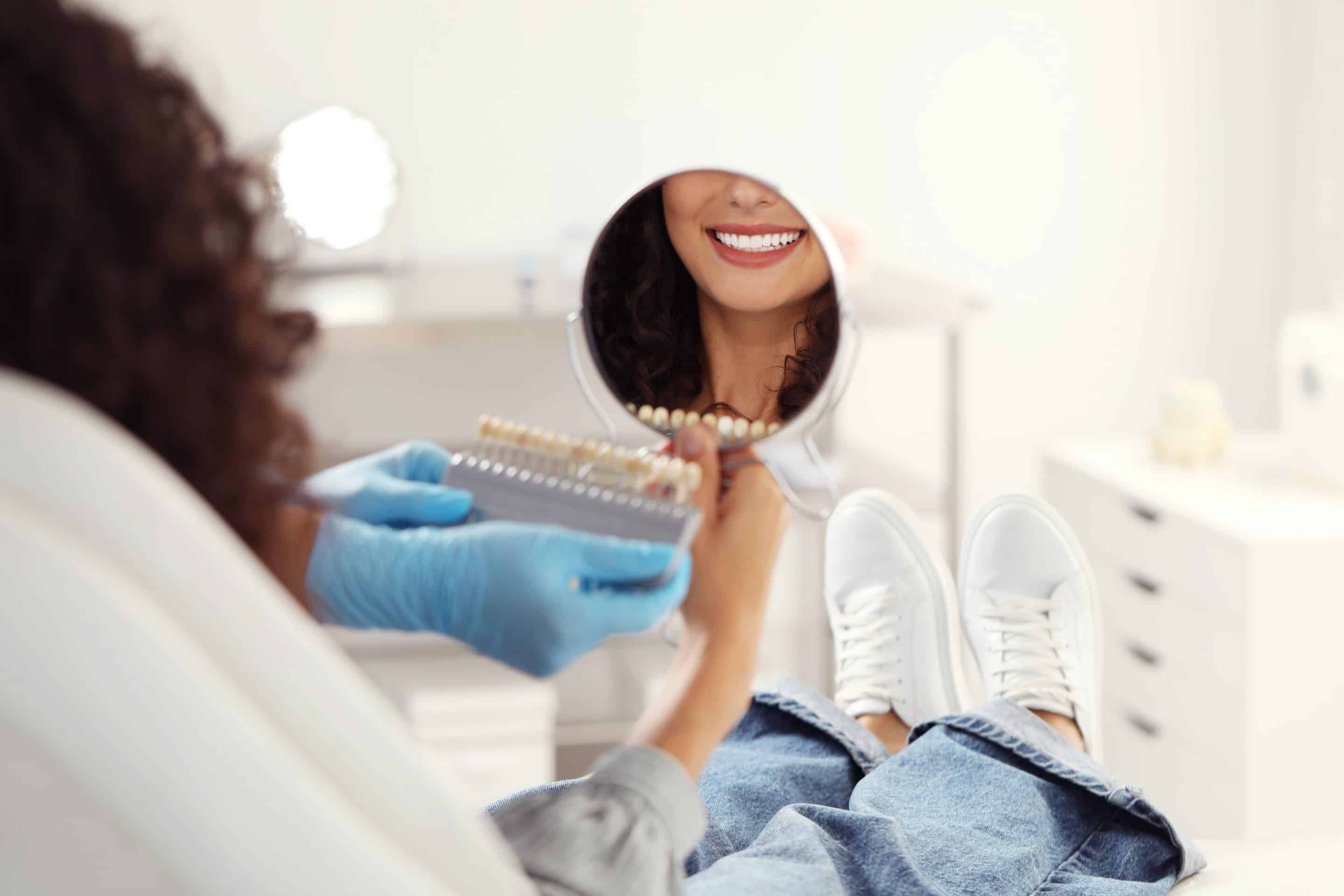 dental patient smiling during veneers consultation at cox family dentistry